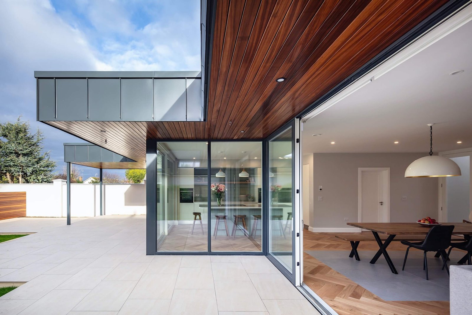 Modern patio glass doors opening to kitchen.