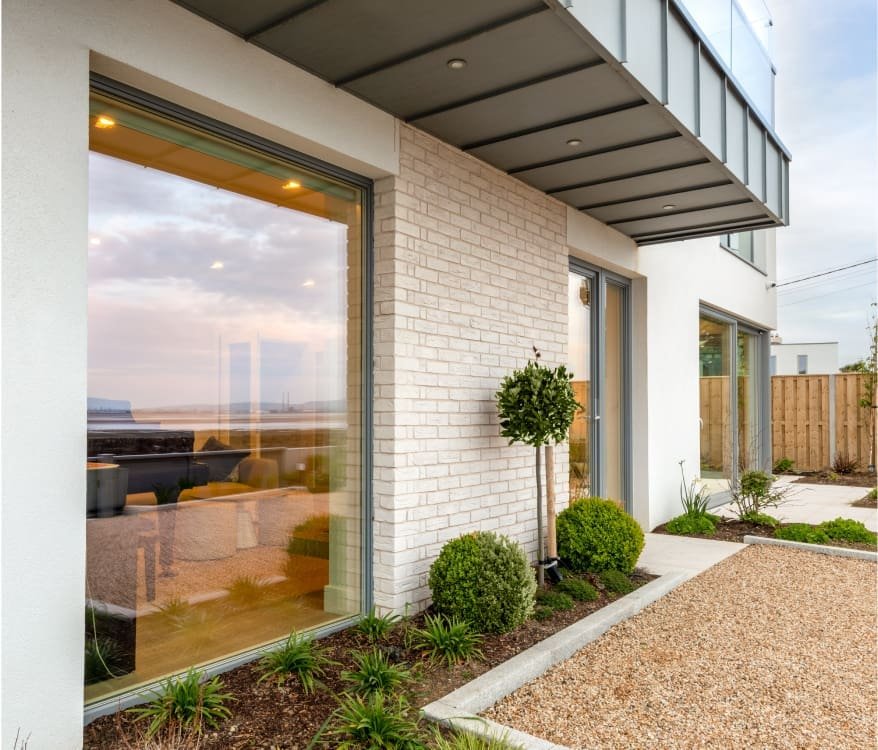 An outside view of a two story modern building.