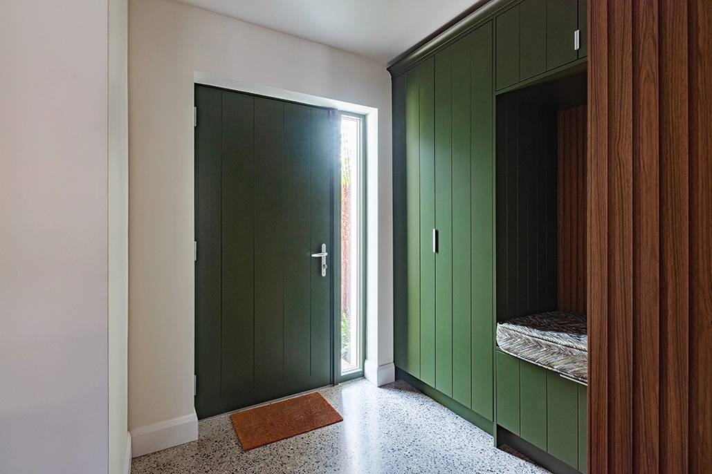Shot of inside hallway of olive door.