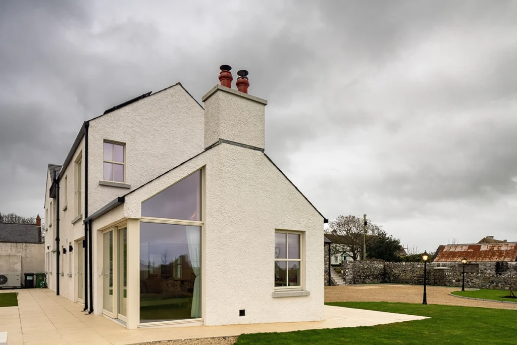 An exterior shot of a two story modern house.