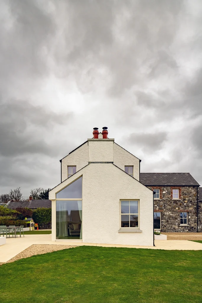 An exterior shot of a two story modern house.