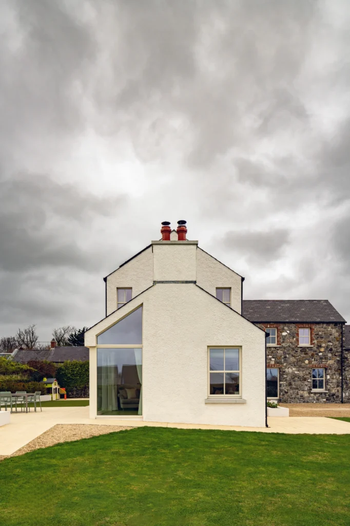 An exterior shot of a two story modern house.