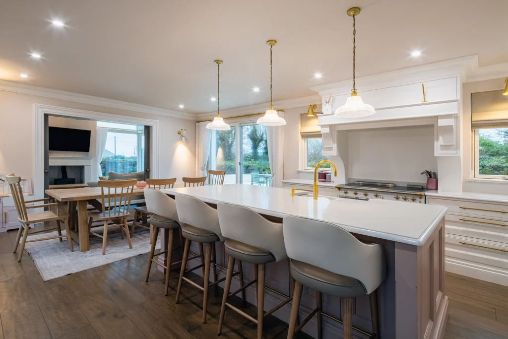 A white and golden modern kitchen.